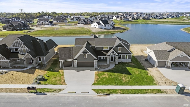 birds eye view of property featuring a residential view and a water view