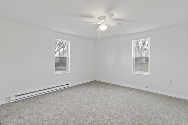 carpeted empty room with ceiling fan, baseboards, and baseboard heating