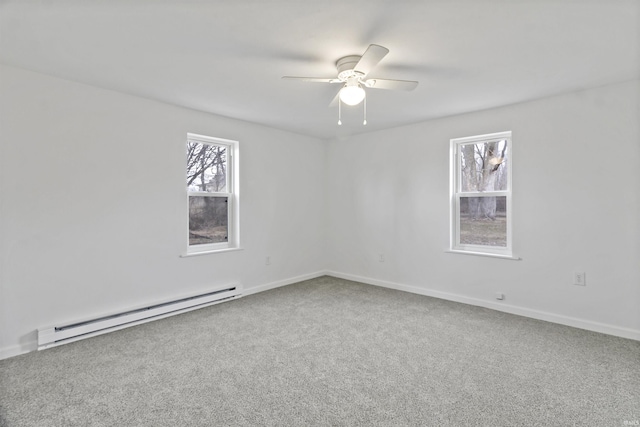 unfurnished room with ceiling fan, baseboards, baseboard heating, and carpet flooring