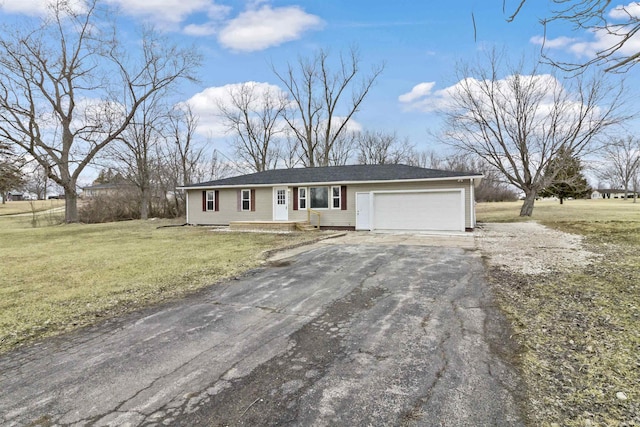 ranch-style home with aphalt driveway, a front yard, and an attached garage