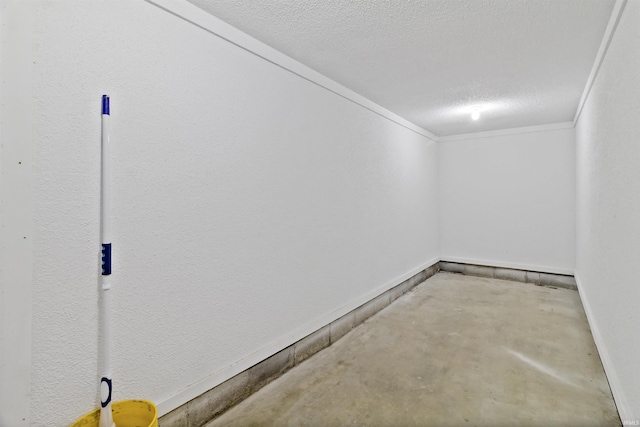 interior space with crown molding, a textured ceiling, and baseboards