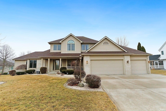 view of front of house with covered porch, driveway, brick siding, and a front yard