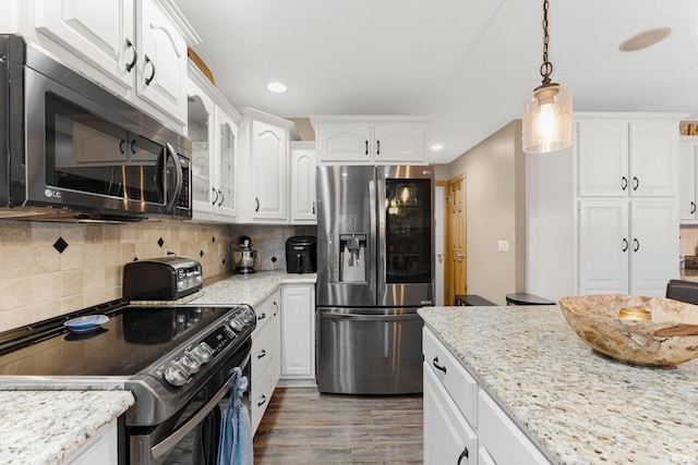 kitchen featuring black range with electric cooktop, white cabinetry, stainless steel refrigerator with ice dispenser, tasteful backsplash, and dark wood finished floors