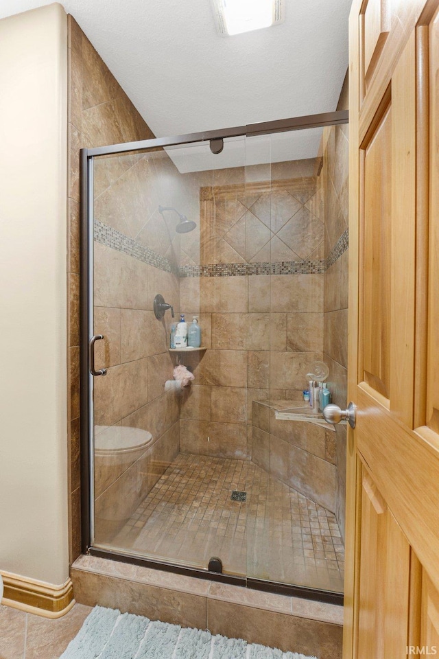 full bathroom featuring a shower stall