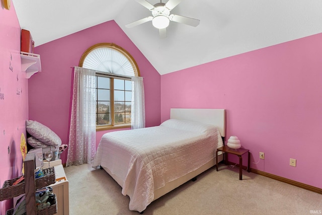 bedroom with carpet, baseboards, vaulted ceiling, and a ceiling fan