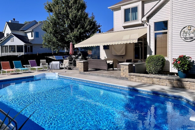 view of pool with a patio and a fenced in pool