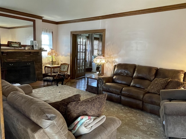 living room featuring a fireplace, wood finished floors, and crown molding