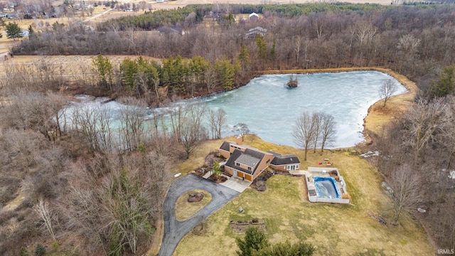 drone / aerial view featuring a view of trees