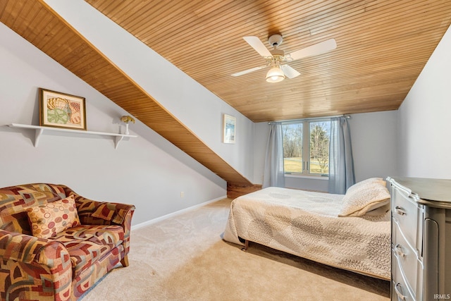 bedroom featuring light carpet, baseboards, ceiling fan, wood ceiling, and vaulted ceiling