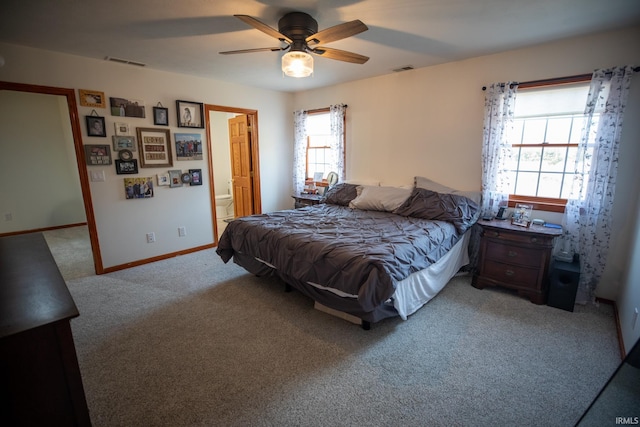 bedroom featuring carpet flooring, visible vents, ceiling fan, and baseboards