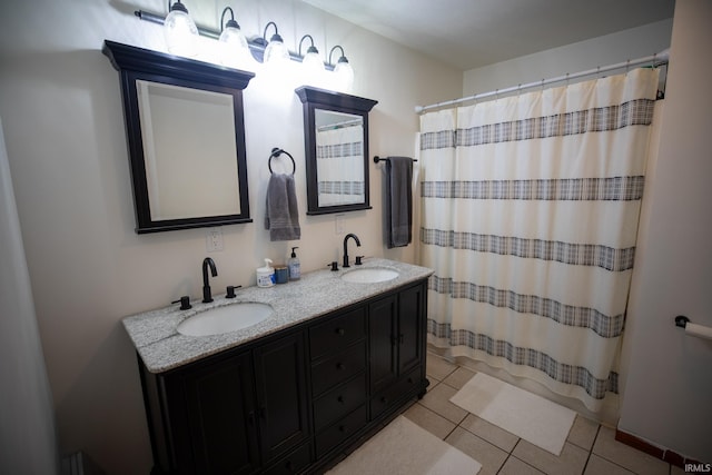 full bathroom with double vanity, a shower with curtain, a sink, and tile patterned floors