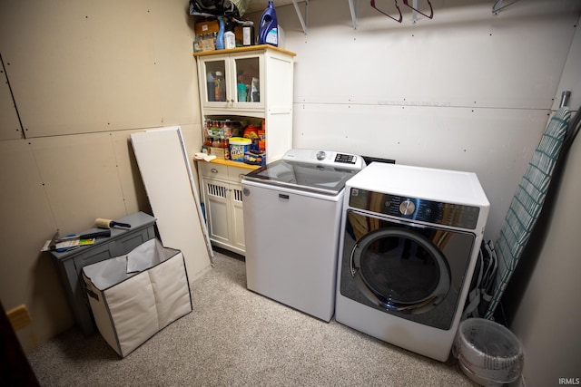 laundry area with laundry area and washing machine and clothes dryer