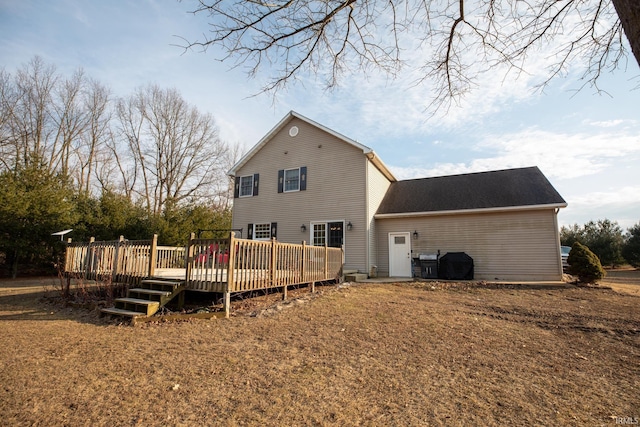 back of house with a wooden deck