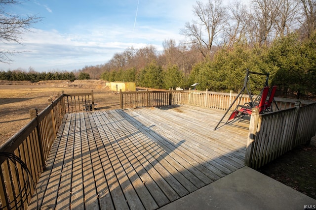 wooden terrace with an outbuilding