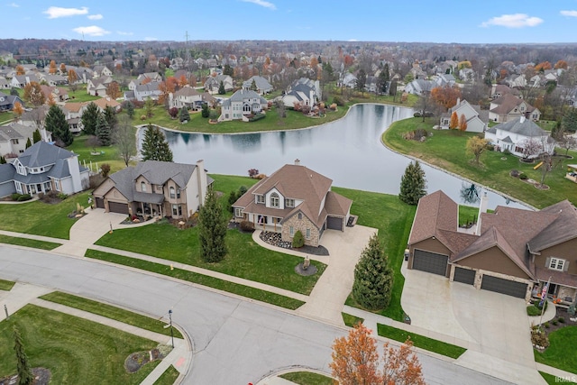 bird's eye view featuring a residential view and a water view