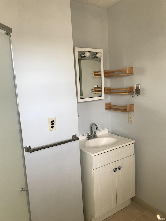 bathroom with vanity and tile patterned floors