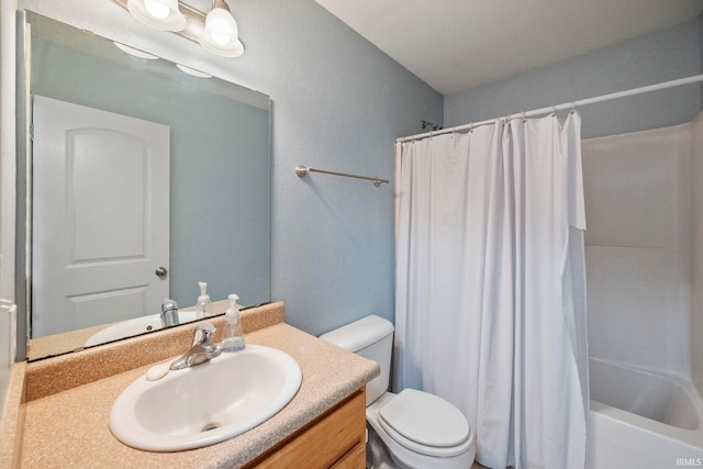 bathroom featuring shower / bath combination with curtain, vanity, and toilet