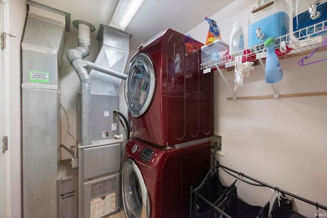 laundry room with laundry area and stacked washing maching and dryer