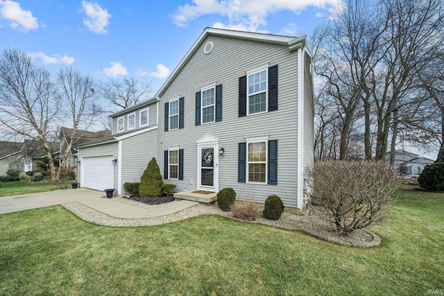 colonial-style house with a garage, a front yard, and concrete driveway