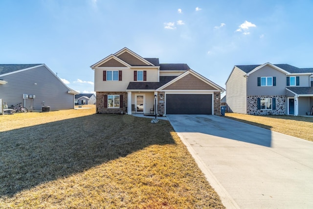 view of front of house featuring driveway, stone siding, an attached garage, cooling unit, and a front yard