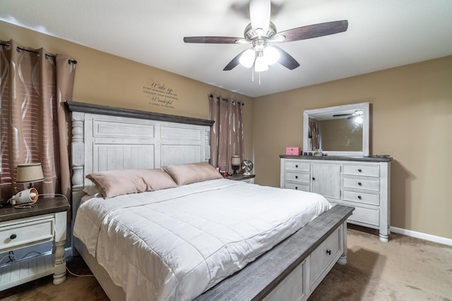 bedroom with baseboards, a ceiling fan, and light colored carpet