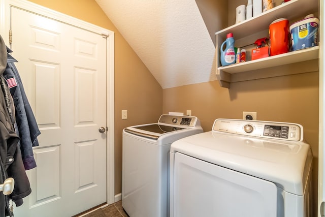 washroom featuring laundry area, independent washer and dryer, and a textured ceiling