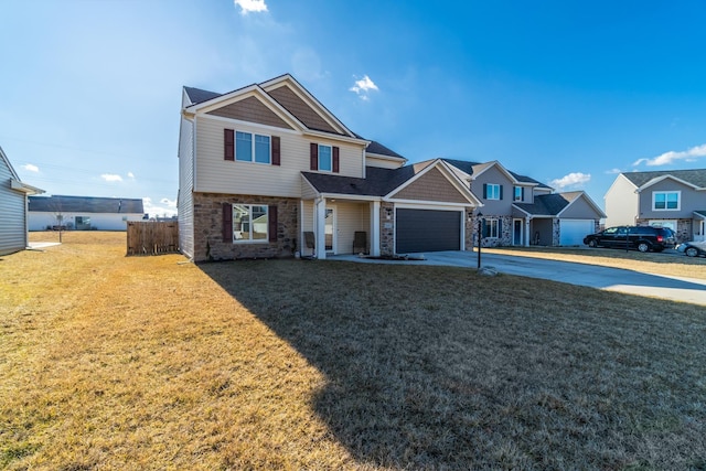 view of front of home with driveway, stone siding, and a front lawn