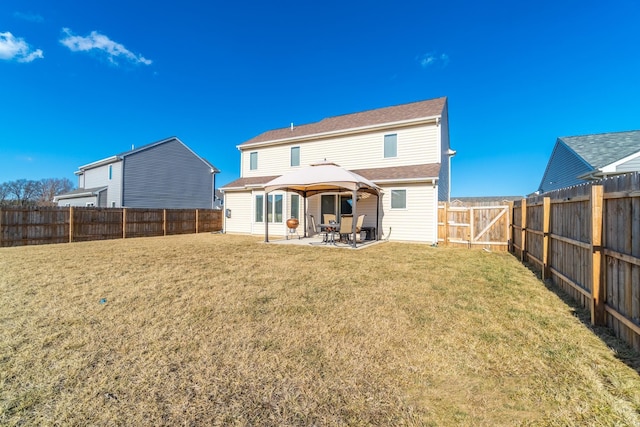 back of property featuring a patio area, a fenced backyard, and a lawn