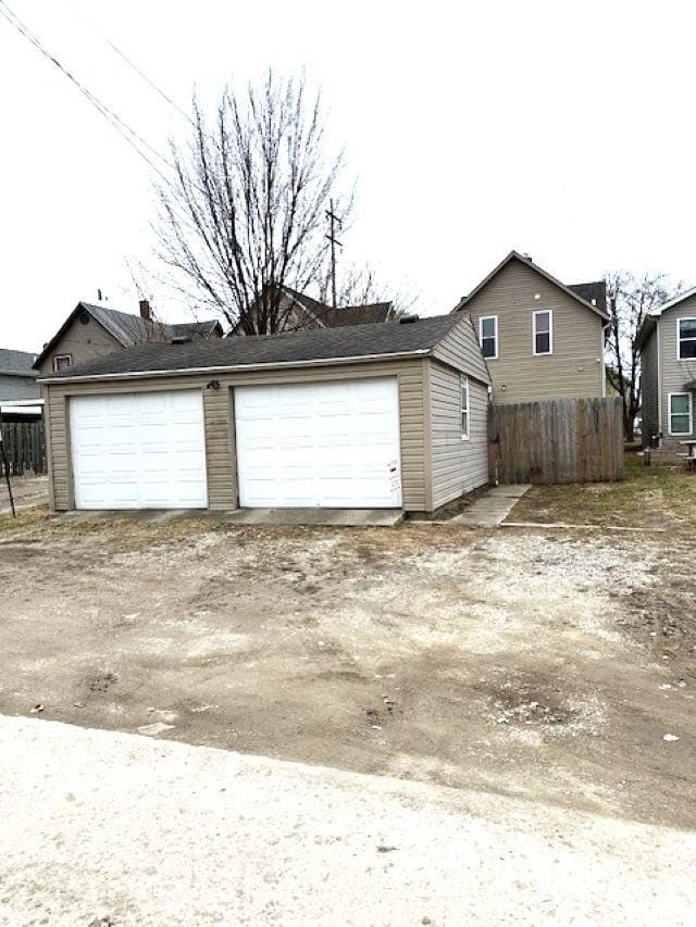 detached garage with fence