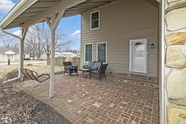 view of patio / terrace featuring fence and outdoor lounge area