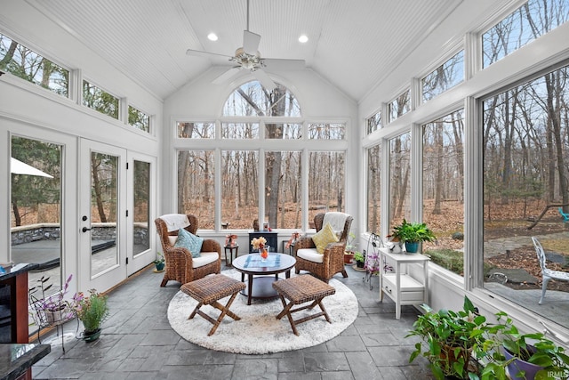 sunroom featuring a ceiling fan and lofted ceiling