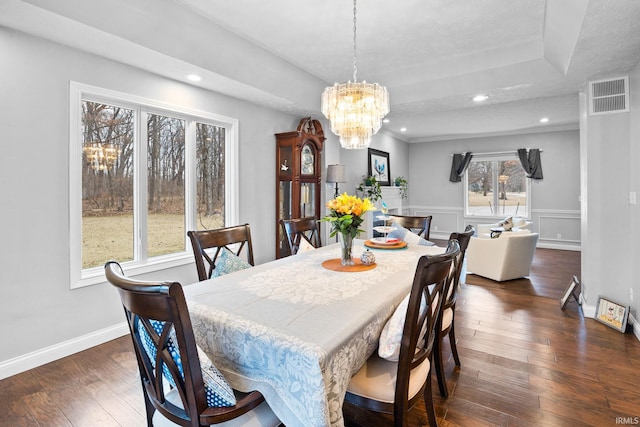 dining room featuring recessed lighting, a notable chandelier, visible vents, wainscoting, and dark wood finished floors