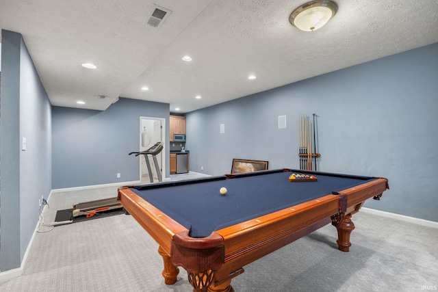 rec room featuring baseboards, visible vents, a textured ceiling, carpet floors, and recessed lighting