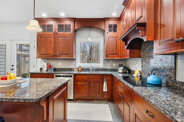 kitchen with stainless steel dishwasher, a sink, glass insert cabinets, and tasteful backsplash