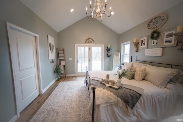 bedroom with high vaulted ceiling, access to outside, baseboards, and light wood finished floors