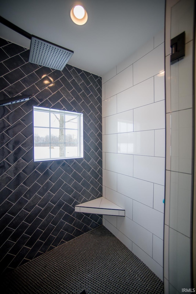 full bathroom with a tile shower