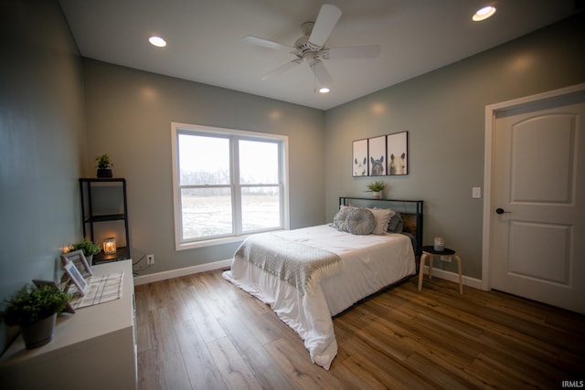 bedroom with ceiling fan, recessed lighting, wood finished floors, and baseboards