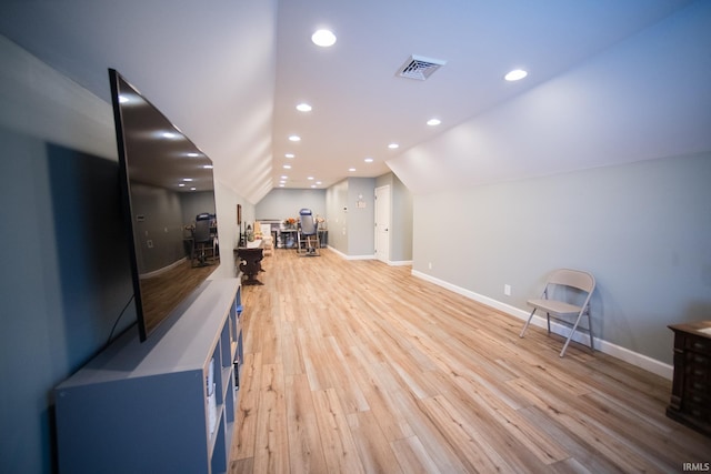 interior space with lofted ceiling, recessed lighting, visible vents, baseboards, and light wood-type flooring