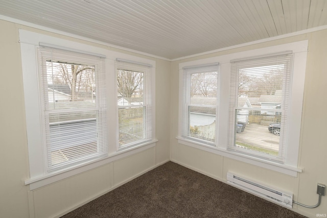 unfurnished sunroom featuring baseboard heating