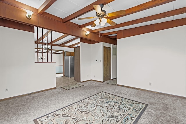 unfurnished living room with baseboards, carpet flooring, beam ceiling, and a ceiling fan