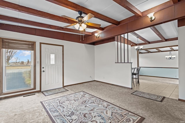 carpeted entryway featuring visible vents, beam ceiling, and baseboards