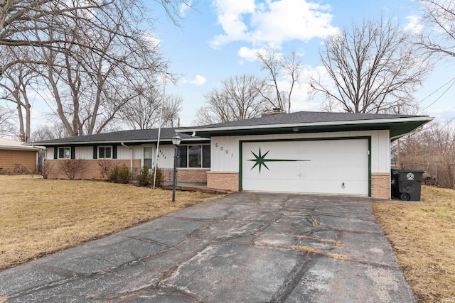 ranch-style house featuring a front lawn, brick siding, driveway, and an attached garage