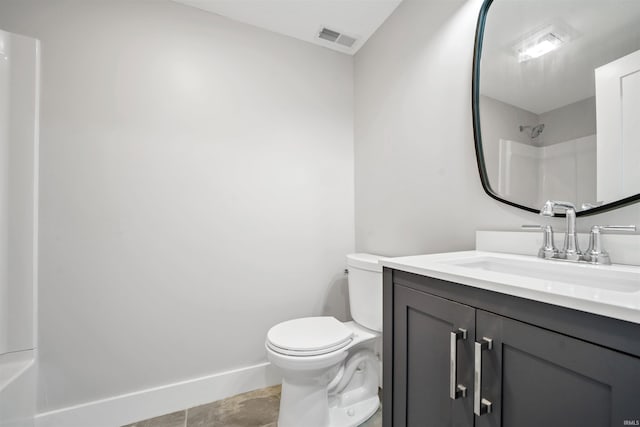 bathroom with visible vents, toilet, vanity, baseboards, and walk in shower