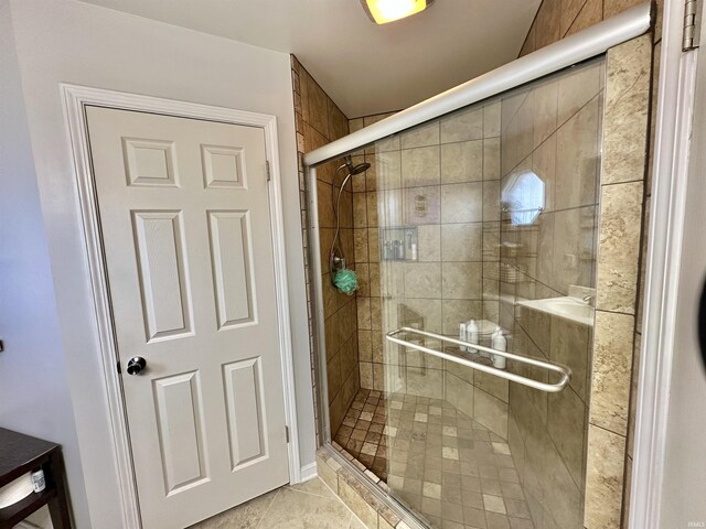 bathroom with a shower stall