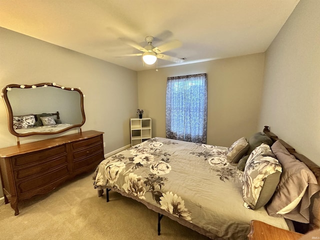 bedroom with light carpet and ceiling fan