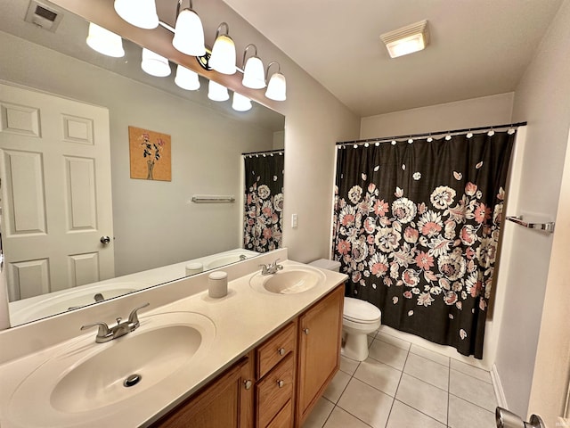 bathroom featuring toilet, tile patterned flooring, visible vents, and a sink