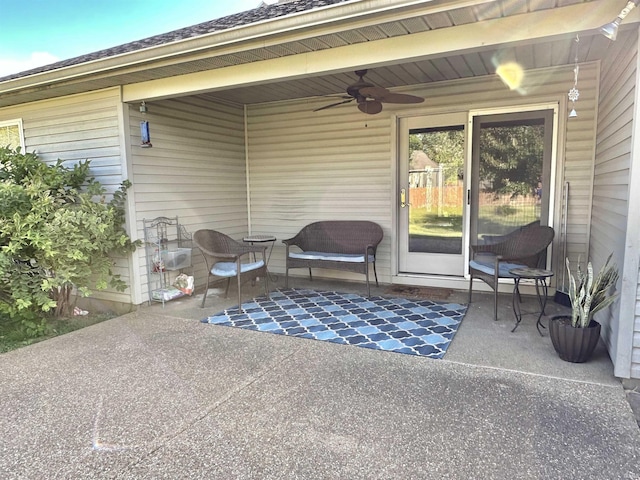 view of patio featuring a ceiling fan and a carport