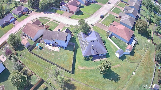 birds eye view of property with a residential view