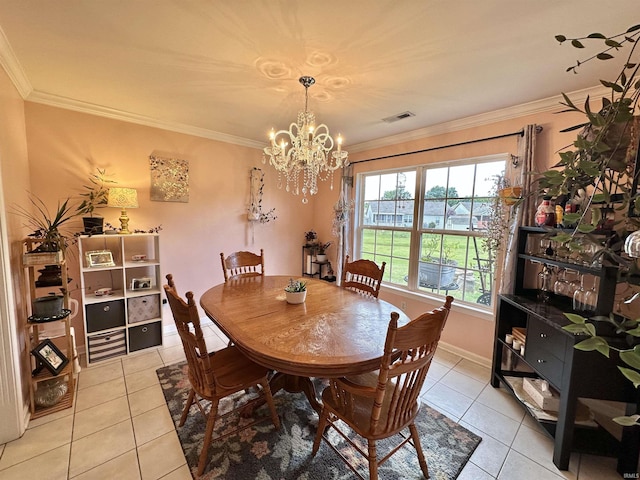 dining space with a chandelier, visible vents, crown molding, and light tile patterned floors