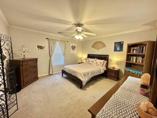 bedroom with ceiling fan, carpet floors, visible vents, baseboards, and crown molding